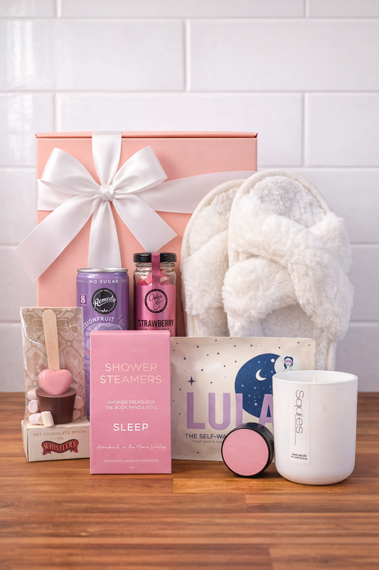 Collection of self-care items including slippers, candles, and shower steamers.